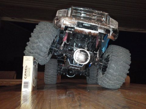 1985 Ford Bronco - RC monster truck front view with a pack of Camel cigarettes for scale.
