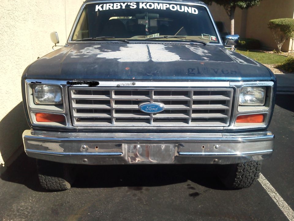 Front view of a 1985 Ford Bronco with a chrome grille and bumper