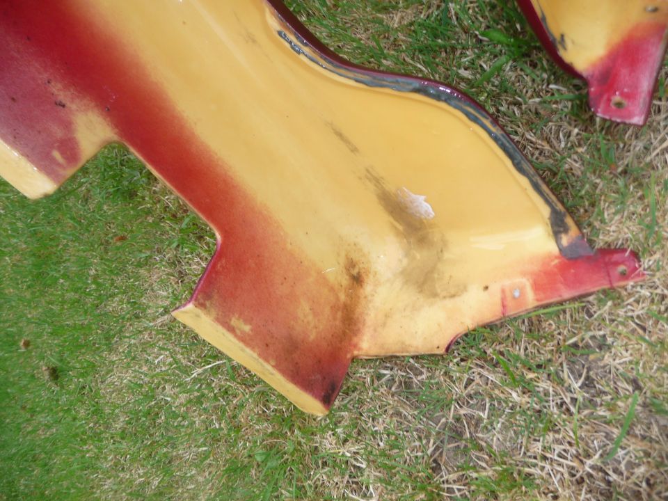 Yellow and red side skirts on grass