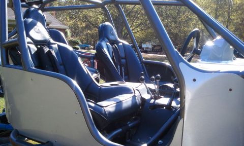 1967 Ford Mustang - Interior view of a custom off-road buggy, showing seats, roll cage, and controls.
