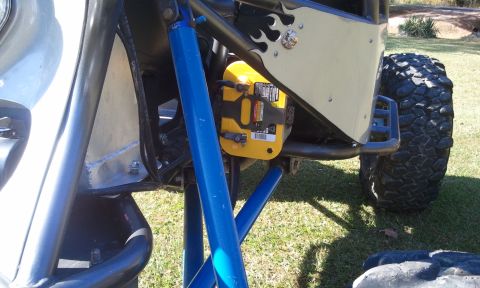 1967 Ford Mustang - This buggy features a prominent yellow battery box and aggressive off-road tires, indicating it's built for rough terrain.