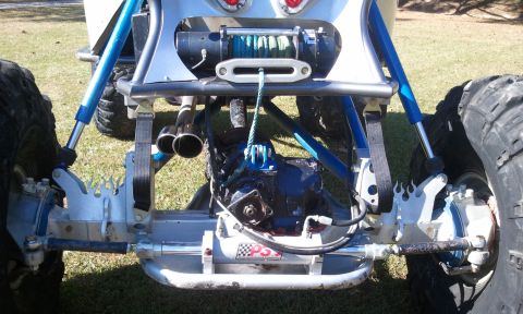 1967 Ford Mustang - The rear of a custom off-road buggy shows its exposed drivetrain, winch, and suspension components.