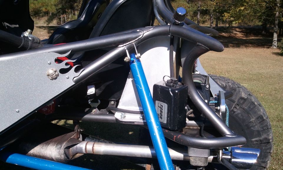 Custom buggy rear suspension with blue shock and black reservoir
