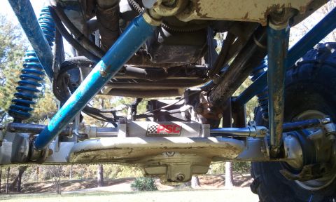 1967 Ford Mustang - Custom off-road buggy suspension components, including shocks and steering system.
