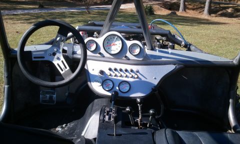1967 Ford Mustang - Interior view of a custom off-road buggy, a racing steering wheel and a complex dashboard.
