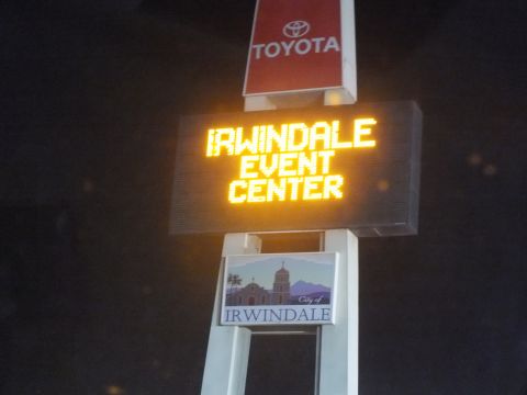 2003 Ford Crown Victoria - Glowing sign for the Irwindale Event Center topped by a Toyota brand mark at night.
