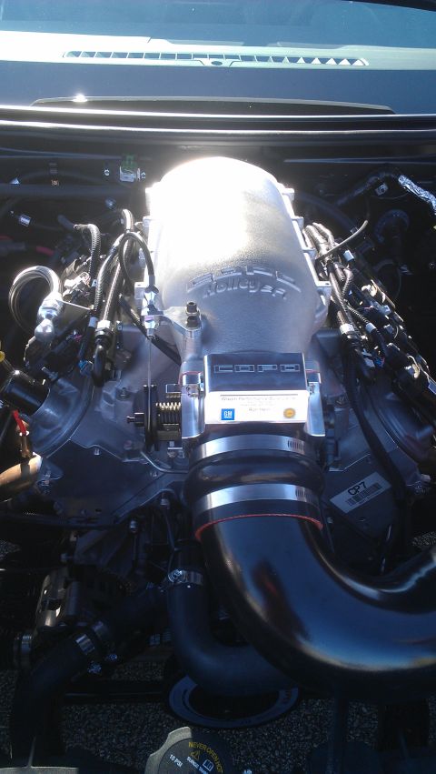 1973 Chevrolet Camaro - The engine features a prominent Holley intake manifold and various hoses and wiring.