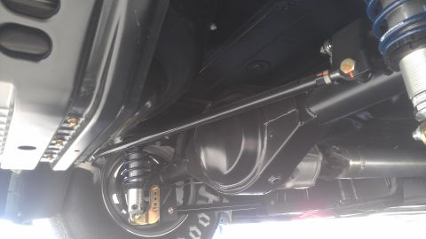 1973 Chevrolet Camaro - Close-up view of the rear differential and suspension system of a modified vehicle.
