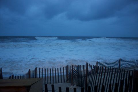 1990 Ford Bronco - Rough seas and dark clouds suggest an approaching storm over the ocean.