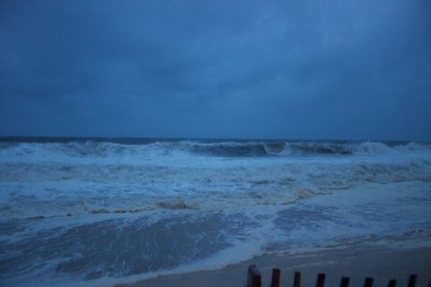 1990 Ford Bronco - The turbulent ocean during a storm, with large waves rolling towards the shore.