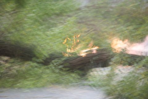 1990 Ford Bronco - A blurry scene depicts debris and fire, with a watermark at the bottom right.