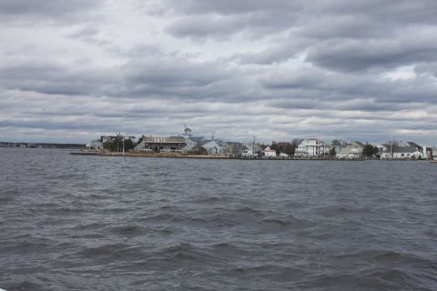 1990 Ford Bronco - View of a waterfront town with buildings and boats on a cloudy day.
