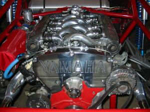 1993 Ford Taurus - A highly polished Yamaha V8 engine is shown, prominent branding and custom tubing.