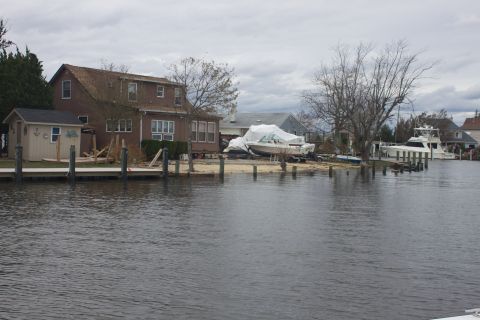 1990 Ford Bronco - Boats and houses damaged or affected by a storm on a waterfront.