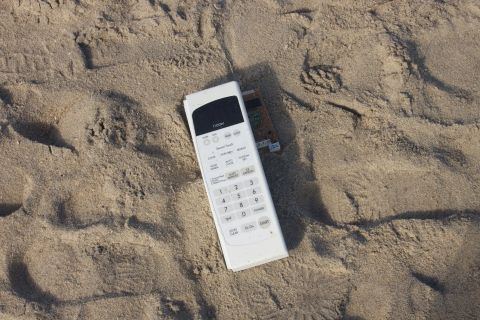 1990 Ford Bronco - Remote control and credit card found on the beach sand.