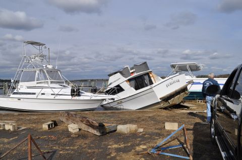 1990 Ford Bronco - Boats are seen on land after Hurricane Sandy, with one vessel tilted at a steep angle.