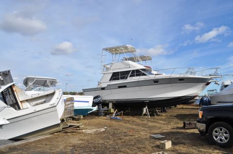 1990 Ford Bronco - Boats are lined up on stands in a dry dock, awaiting their next season on the water.