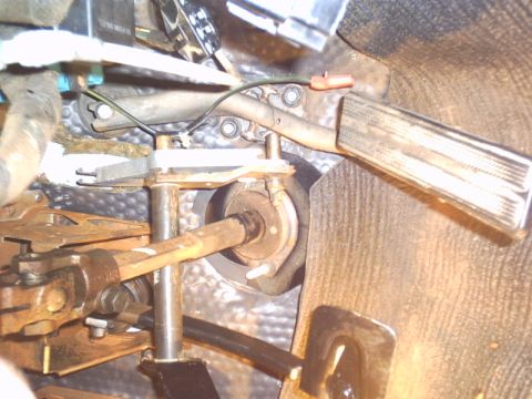 1991 Ford LTD Crown Victoria - Close-up of the interior pedal assembly, showing the brake and accelerator pedals and associated linkage.