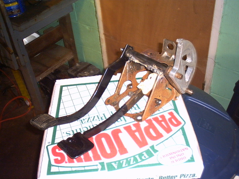 Car brake and gas pedals assembly on a pizza box