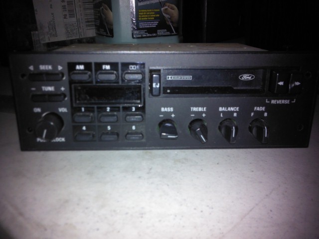 Ford car radio with AM/FM, CD, and cassette player controls