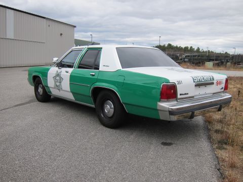 1991 Ford LTD Crown Victoria - This 1991 Ford Crown Victoria LTD is marked as a sheriff's vehicle with "SHERIFF" and "1911" visible on the rear.