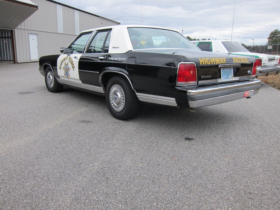 Rear view of a 1991 Ford Crown Victoria LTD highway patrol car
