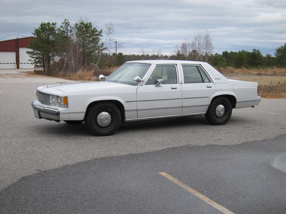 White 1991 Ford Crown Victoria LTD sedan, side view