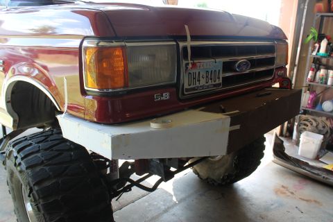 1990 Ford Bronco - Front view of a 1990 Ford Bronco undergoing a custom bumper build, a Texas license plate.