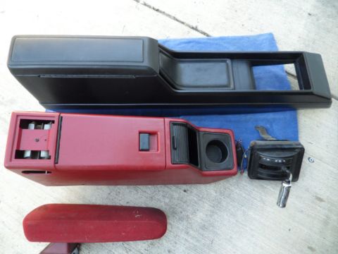 1994 Jeep Cherokee - Various interior parts from a vehicle are laid out on a blue cloth.