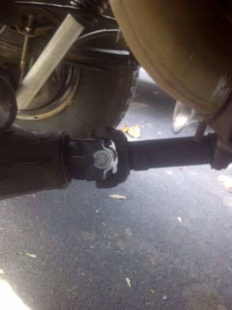 1995 Ford Bronco - Undercarriage view shows the driveshaft and rear axle assembly of a vehicle.