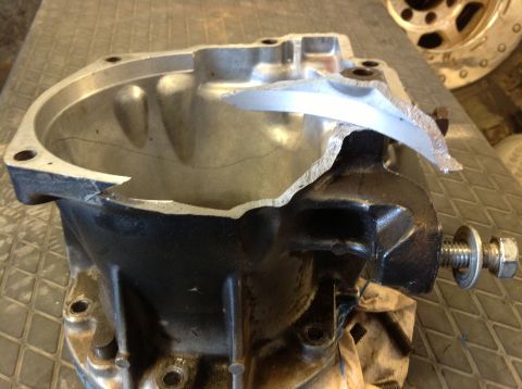 1966 Ford Bronco - This transmission housing is severely damaged, showing a significant crack and a piece broken off.