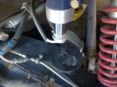 1966 Ford Bronco - Detail shot of the suspension system, red coil springs and hydraulic lines.
