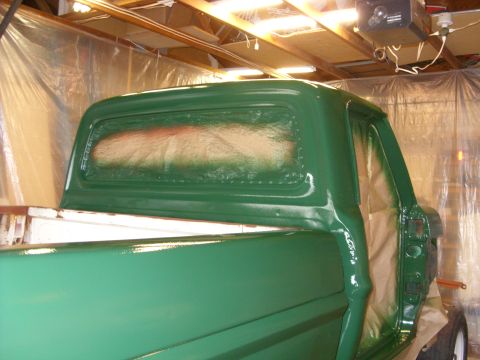 1967 Ford F-250 - The cab of a 1967 Ford F-250 pickup truck is shown during a painting process.