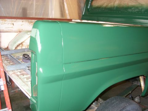 1967 Ford F-250 - The rear corner of a 1967 Ford F-250 pickup truck is shown after being painted green.