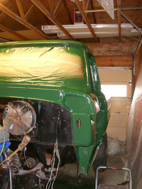 1967 Ford F-250 - A green 1967 Ford F-250 truck cab is seen in a garage, undergoing a paint job.