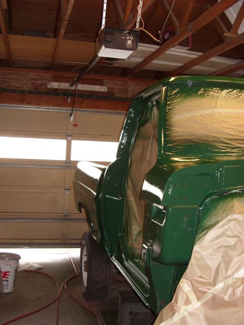 1967 Ford F-250 - Pickup truck undergoing a green paint job in a garage with the doors open.