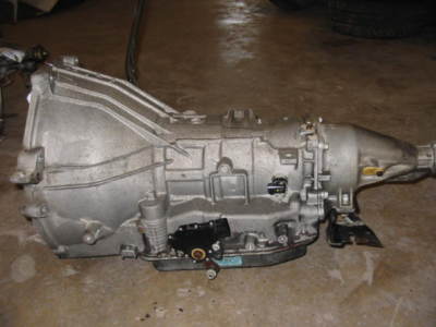 1969 Ford Torino - An automatic transmission is shown on a concrete floor.