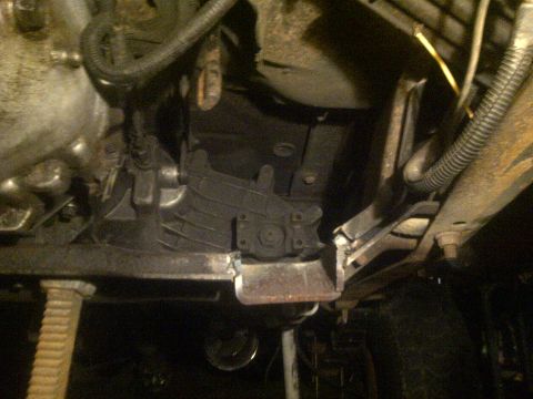 1995 Ford Bronco - Close-up view of the undercarriage, focusing on the transmission and exhaust components.