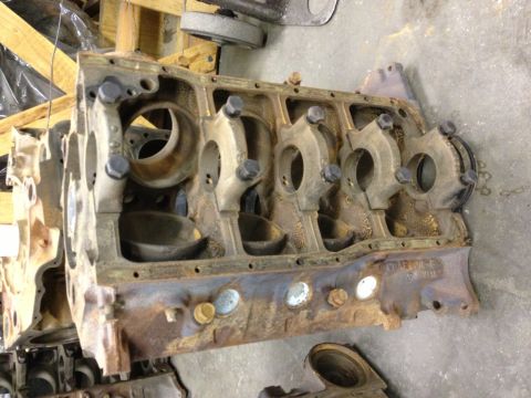 1987 Ford Ranger - Engine block with connecting rods, part of a vehicle tear down. Year and make are not identifiable from the image.