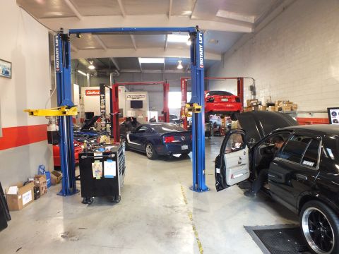 2003 Ford Crown Victoria - Dyno software display with speed and RPM dials and an air/fuel gasoline gauge reading 12.8