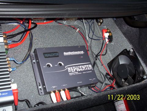 2003 Ford Taurus - Car audio equipment is installed in the trunk of a vehicle, dated 11/22/2003.