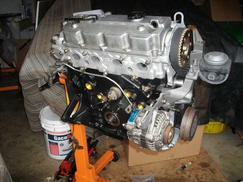 1989 Ford Probe - Engine assembly on a stand, showing various components and mechanical details.