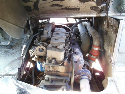 1979 Ford Bronco - The engine compartment of a large vehicle is shown, focusing on the diesel engine and its components.