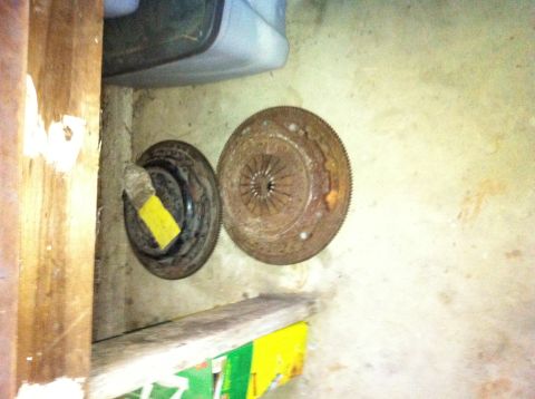 1986 Ford Bronco - These automotive parts appear to be clutch and flywheel assemblies, showing signs of rust and wear.