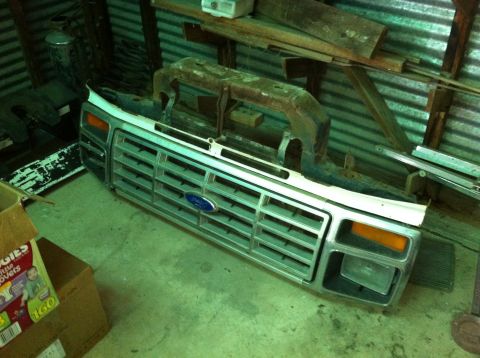 1986 Ford Bronco - Front grille and bumper assembly for a 1986 Ford Bronco, the iconic Ford emblem.