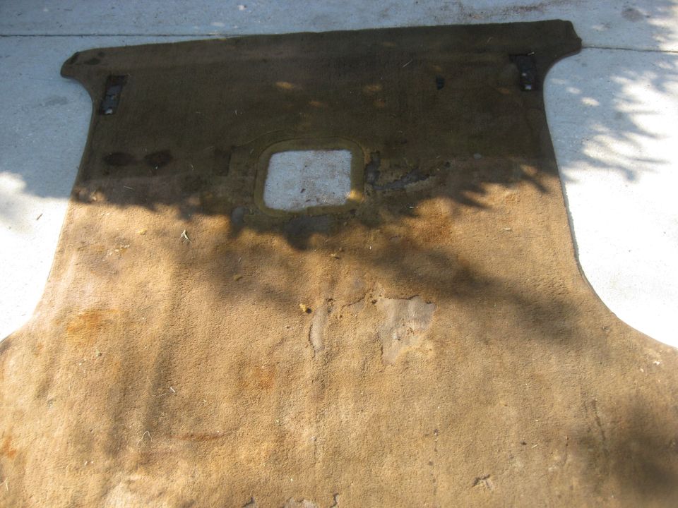 Cargo area carpet removed. This carpet is too far gone to clean and reuse.