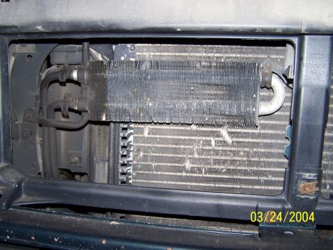 1986 Ford Bronco - The front of a vehicle shows its radiator and AC condenser, with a date stamp of 03/24/2004.