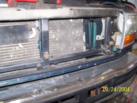 1986 Ford Bronco - Close-up of the front grille and radiator of a 1994 Ford Bronco, showing the vehicle's front end.