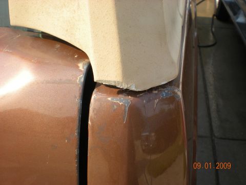 1986 Ford Bronco - Detail shot of vehicle body panels and trim, showing wear and paint chipping.