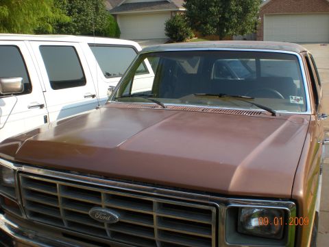 1986 Ford Bronco - Front view of a 1986 Ford Bronco, showing the grille and hood detail.